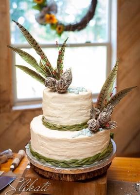 Sweet grass and sage flowers make this cake perfect for a Montana wedding by the lake!