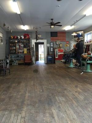 My dad in the barber chair. Cool old-timey atmosphere.
