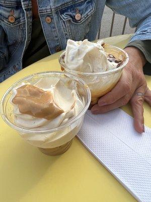 The large is the one with the ice cream barely sticking out of the same size cup of the medium.