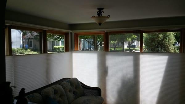 A sun room with top down bottom up Honey comb shades. A nice option to controlling the light and still enjoining privacy.
