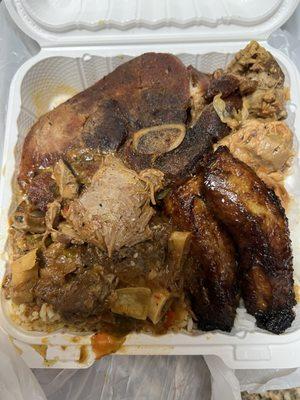 Combination dinner. Pork chop, stew and chicken with plantains