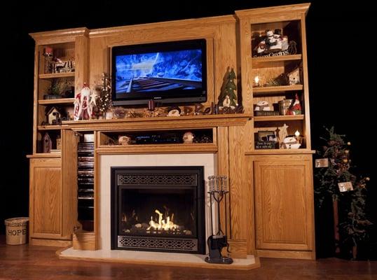 Bookcase with Upper Panel DVD storage in the mantel legs, Electronics pocket above gas fireplace