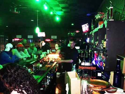 Proprietor and celebrity bartender Chris Wa slinging drinks at the all new 19th Hole Sports Bar in Hallandale Beach.