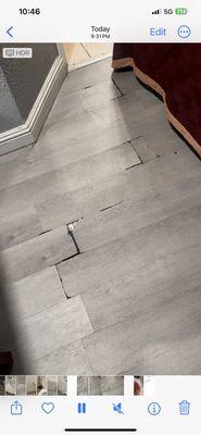 Wooden floors are cracked and sticking up. Tripping hazard. This will definitely cut your feet open if you walk on it.