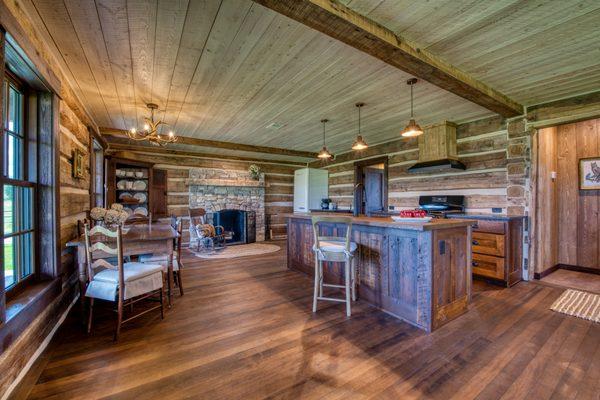 Refinished floors and custom cabinets made with restored wood from property