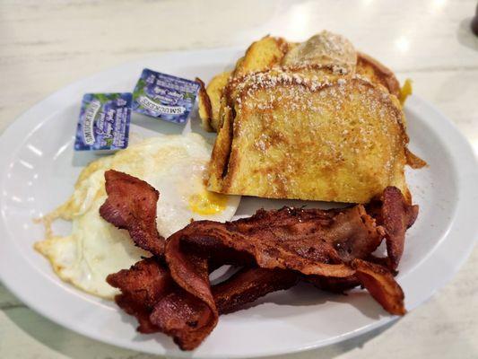 French Toast Platter with fried eggs and all bacon