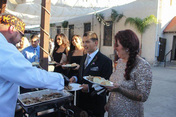Tex Serving BBQ Pulled Pork at a wedding reception!