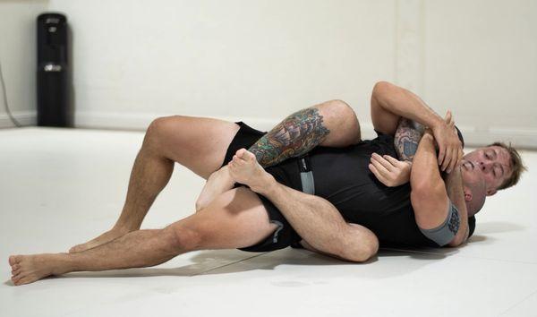 Dossman and Nick rolling No Gi