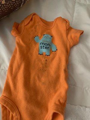 Black stain on NEW onesie
