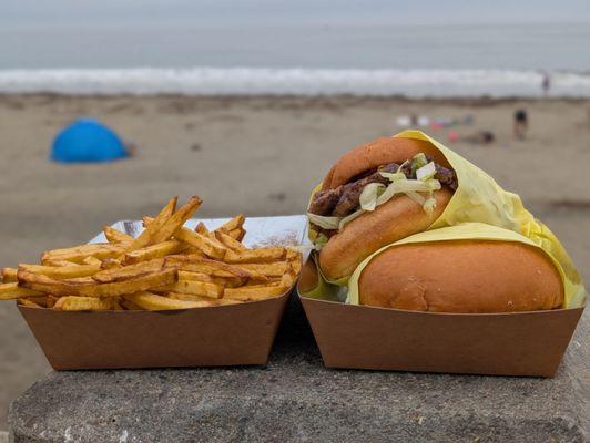 Basket of fries and double burgers with lettuce and tomato