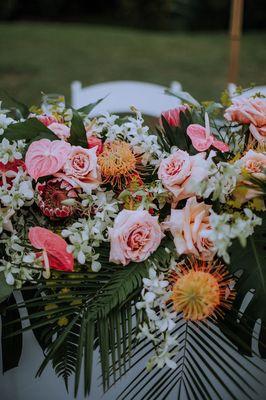 Close up ceremony flowers being used for the sweetheart table.