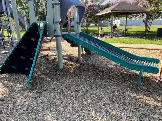 Little kid playground set with roller slide