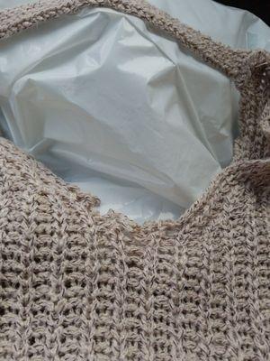 Knitted sweater unraveled during first wear right in the middle of the neckline.