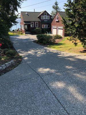 After photo of large driveway pressure washing.