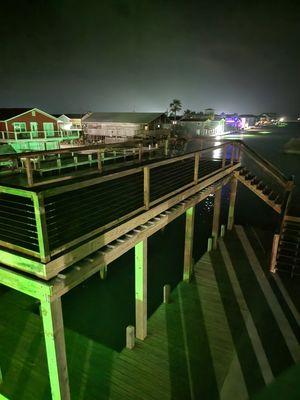 Rooftop deck over a boathouse and dock.