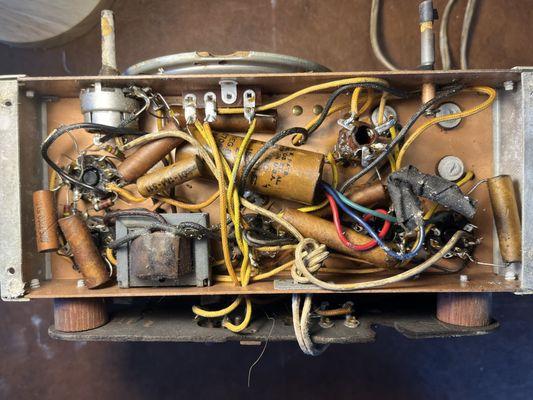 Under chassis of an RCA X35 All American 5 AM Receiver. Made about 1941-42. Most caps repalced but not all could not read values off old pap
