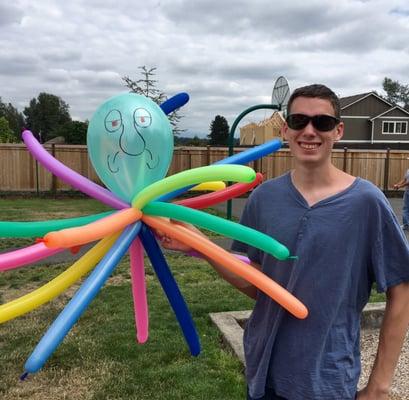 July 2016. Even our oldest son couldn't turn down a balloon creation!