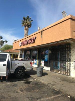 Front of liquor store where you get cold hard cash!!