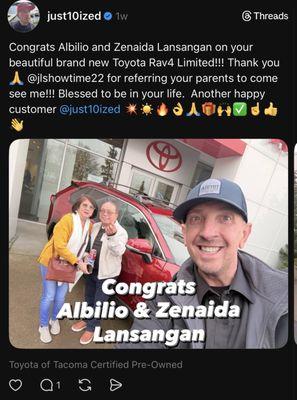 Justin Smith taking a photo with people he helped at this establishment