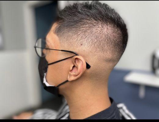 Mid skin fade by Mel