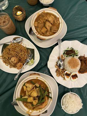 Nyonya Curry Seafood (bottom) Nasi Lemak (right) Mee Goreng (left) Kapitan Chicken (top)