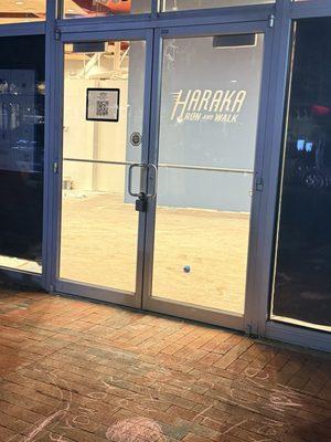 The doorway leading to the store. You're able to see the construction being done within the store.