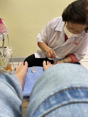 MS. Kim getting my feet right