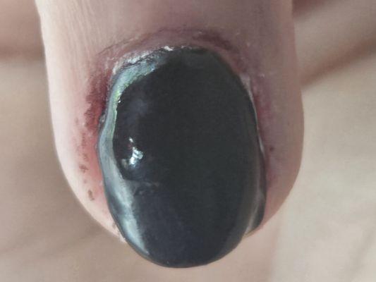 Because the polish was smudged, instead of cleaning it, she cut my skin.