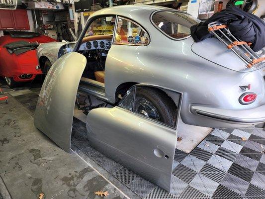 Door and hood removed from car