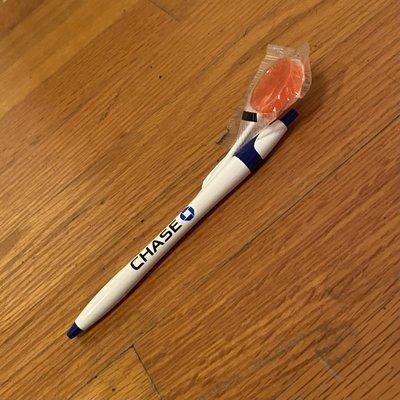 Complimentary blue or black pens and lollipops
