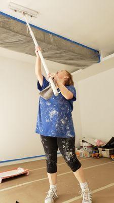 Debra in action with an 18 inch roller on the tall 11 foot ceiling. Wow!! Talk about girl power?!!
