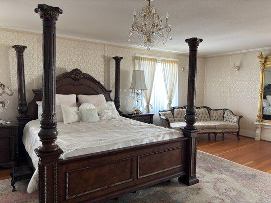 Her room bed and sitting area.