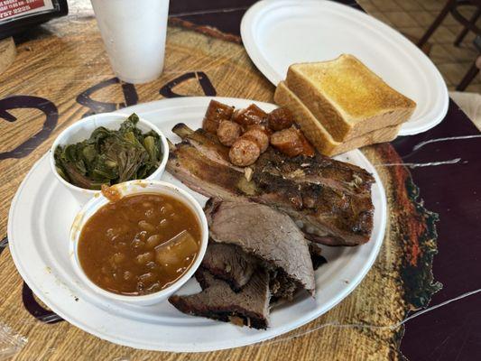 Sausage, Ribs, Beef with mustard greens and baked beans.