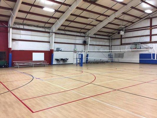 Three indoor volleyball courts
