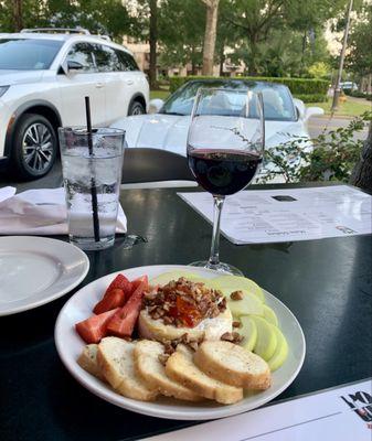 Baked brie wrapped in puff pastry, topped with pepperjelly, pecans and sliced apples.
