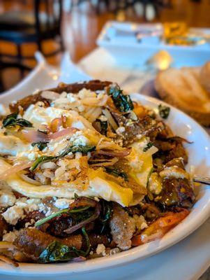 Greek skillet with added onions. Being treated to world class service by Andres.