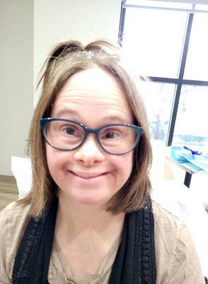 Ali following the procedure, her ponytail holding her bandage in place.