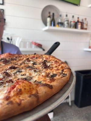 Large pizza with mushrooms and sausage, so yummy!