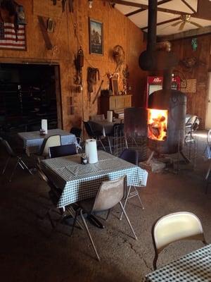 Fire in the stove to heat the auction ring and restaurant. Great warmth from food and the stove.
