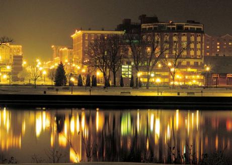 Here is a picture of the St. James Hotel at night with its reflection on the Mississippi River.