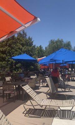 Lots of lounge chairs and umbrellas