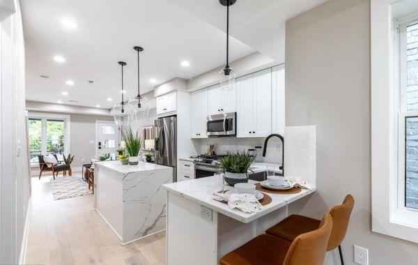 - J&K S8-White Shaker Cabinets
- Quartz Countertops with Waterfalls on the Island