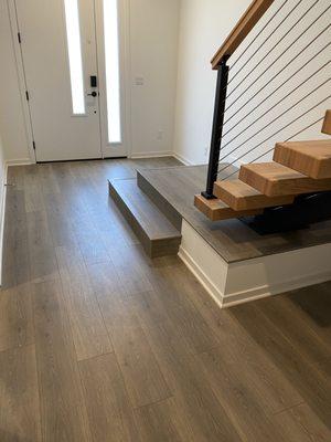 Laminate Floor Installation and Wood Stairs.