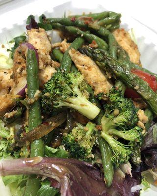 Grilled chicken and vegetables on top of spring mix from the salad bar.
