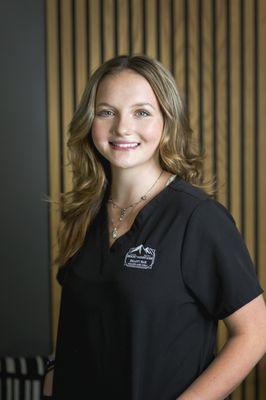 Our Client Care Specialist Hailey, soon-to-be cosmetologist, greets with warmth, paving the way for natural, stunning results!