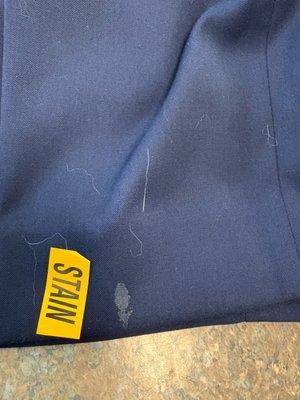 milk spot I specifically told them about upon bringing it in... this is AFTER I picked up the "cleaned" suit