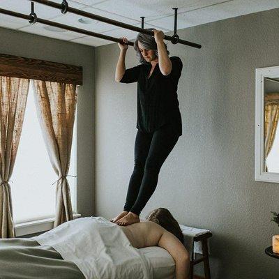 One of our therapists, Melissa, preforming Ashiatsu.