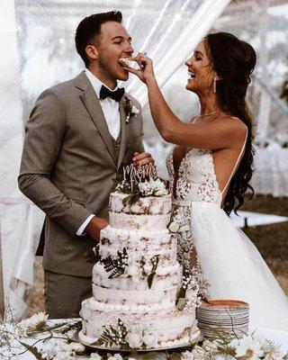 Bride and Groom cutting their wedding cake.