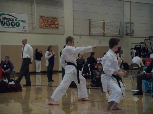 Our black Belt Malachi at a AAU tournament