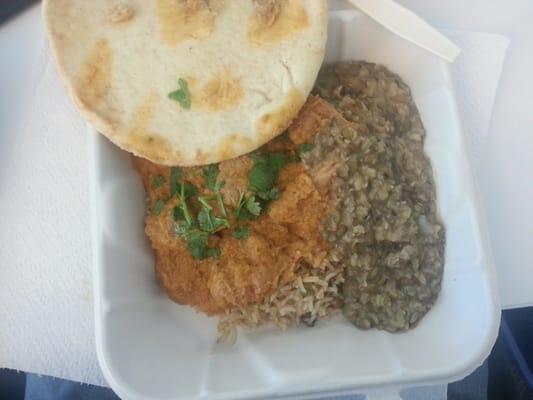 Butter chicken, biryani rice, pita bread.
